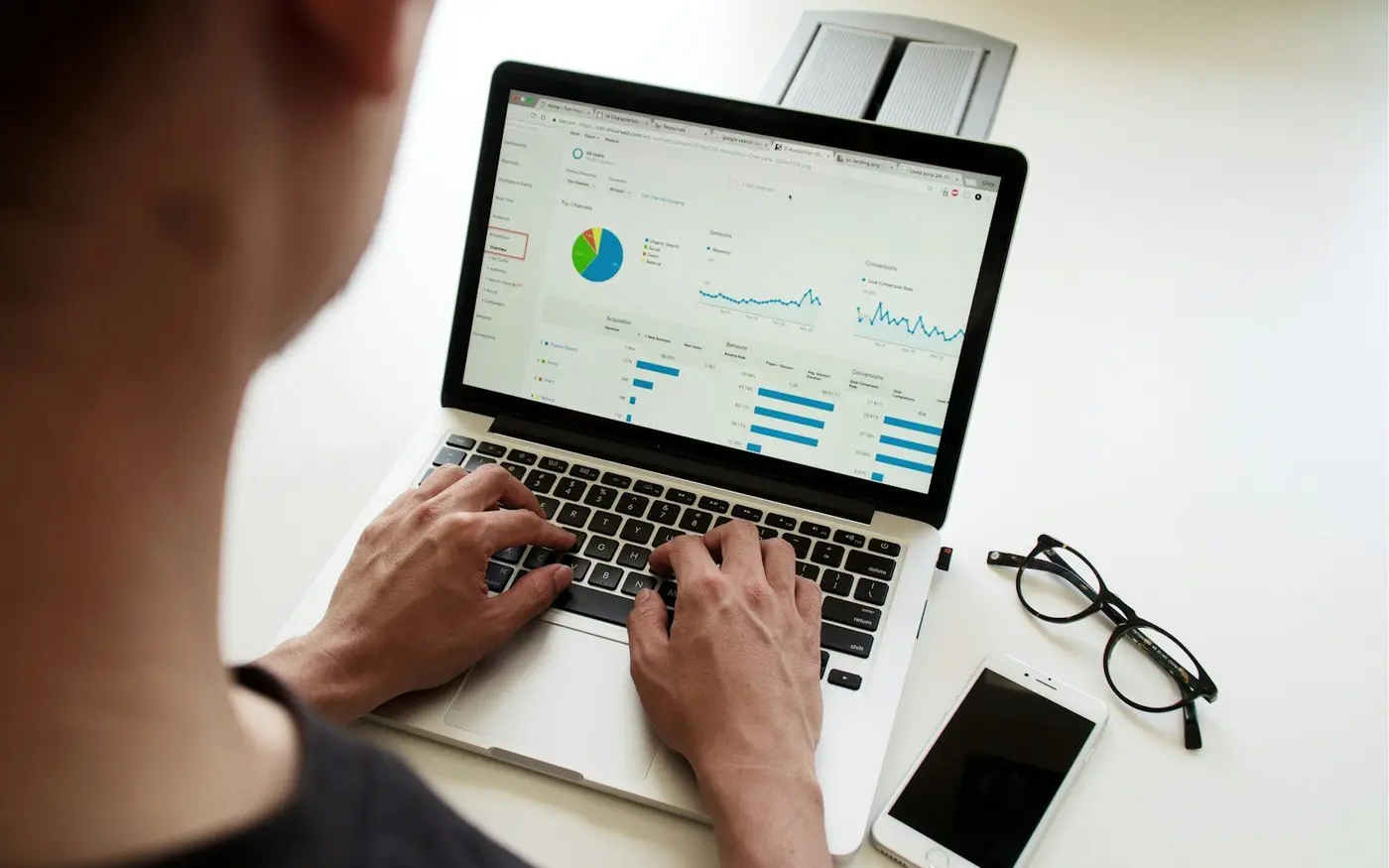 Laptop showing an SEO report with traffic charts